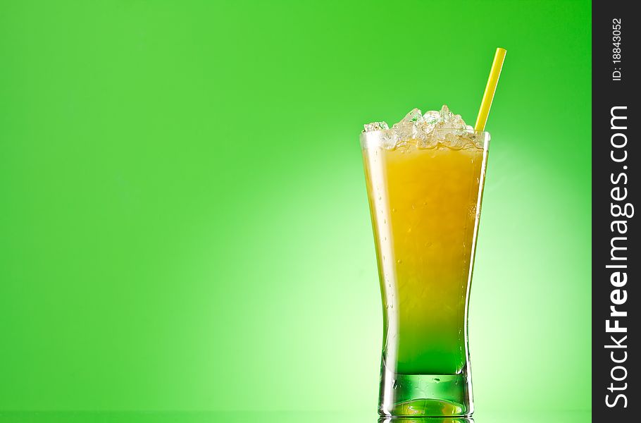 Kivi Pina colada drink cocktail glass isolated on green background. Kivi Pina colada drink cocktail glass isolated on green background