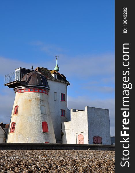 Old lighthouse and surrounding buildings by the beach. Old lighthouse and surrounding buildings by the beach