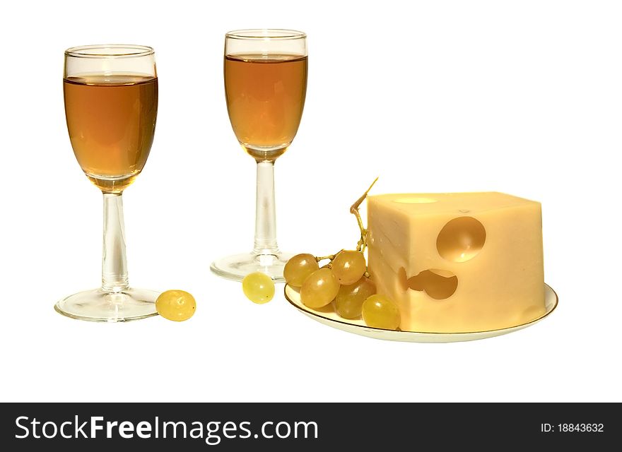 Cheese and white wine in glasses on the white isolated background