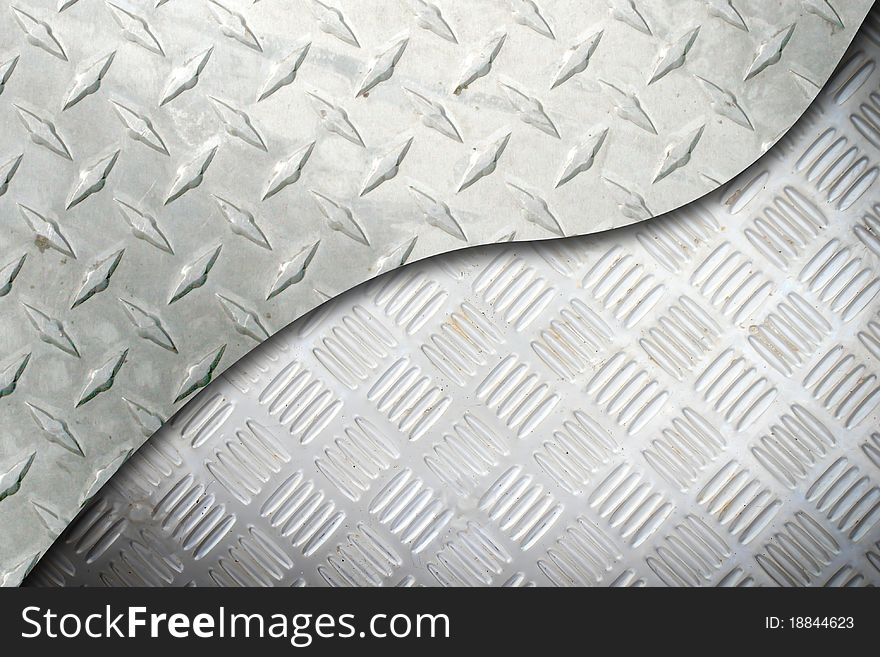 Black and white metallic mesh patterned background. Shallow depth of field. Black and white metallic mesh patterned background. Shallow depth of field