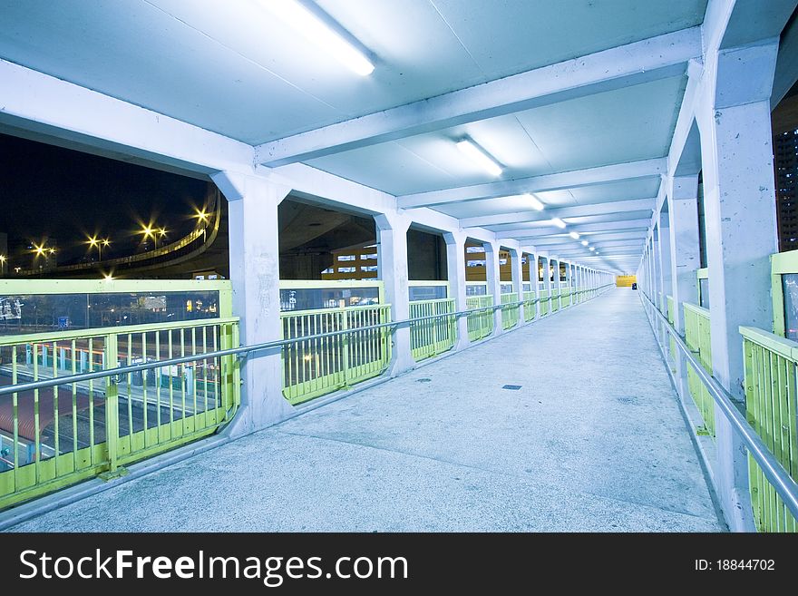 Footbridge With Light Trails In Hong Kong