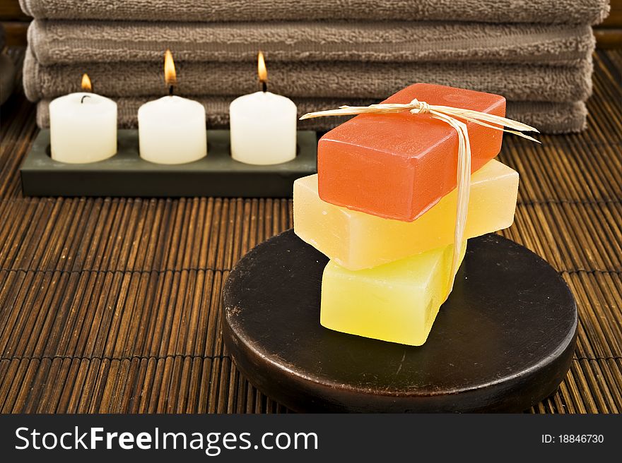 Soap candles and towels in a spa