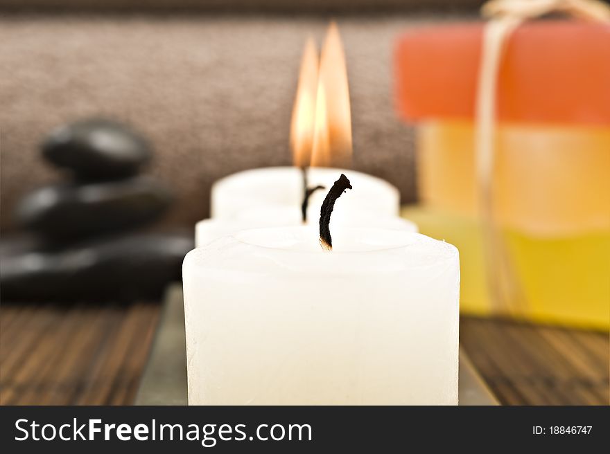Soap candles and towels in a spa - shallow depth of field