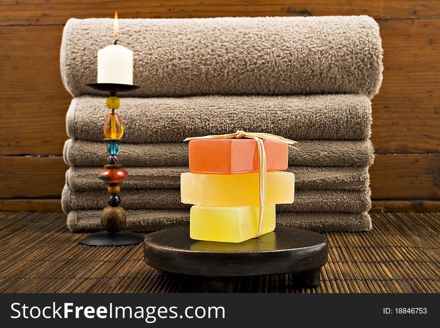 Soap candles and towels in a spa