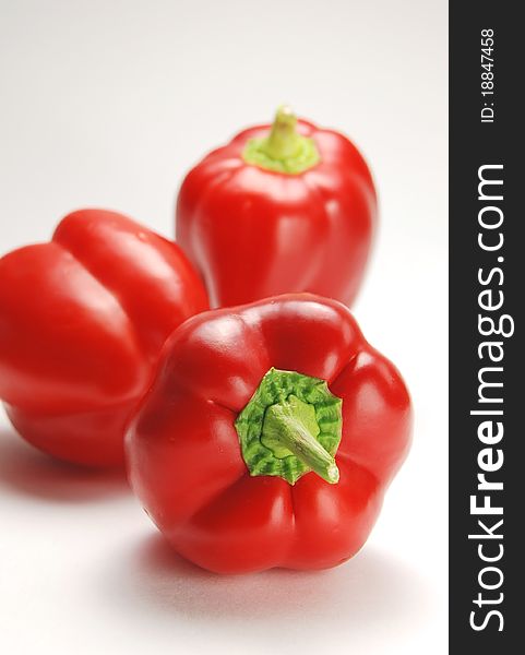 Isolated red pepper pattern on white