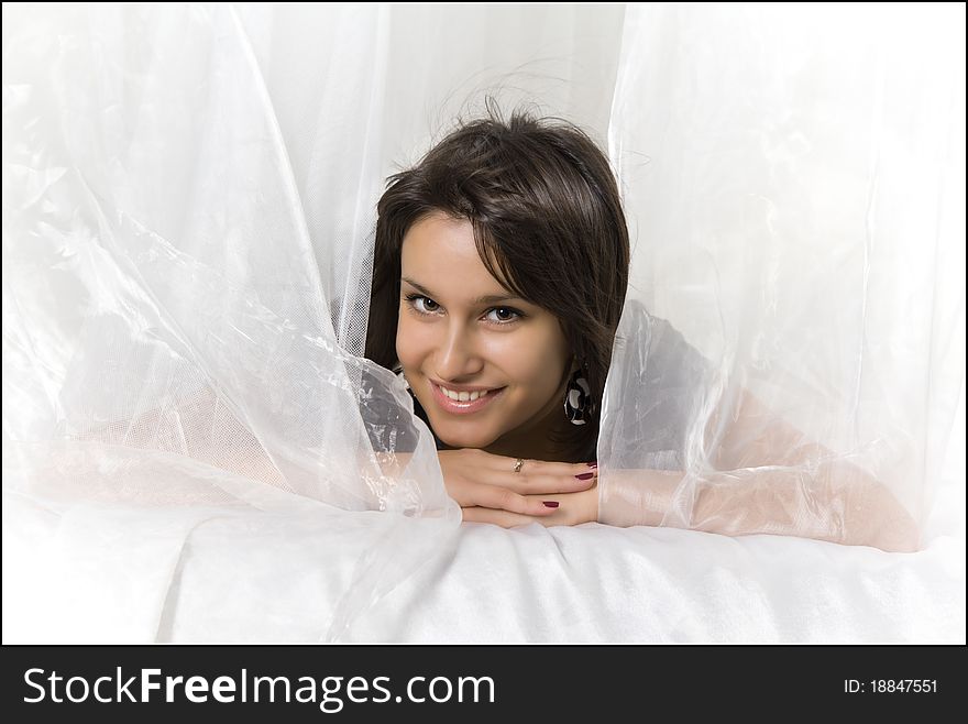 Close-up portrait of a young beautiful smiling woman with dark hair and shining Eyes. Close-up portrait of a young beautiful smiling woman with dark hair and shining Eyes.