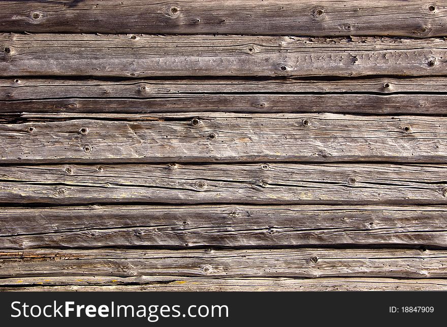 Part of a wall from logs of the old rural house. Part of a wall from logs of the old rural house