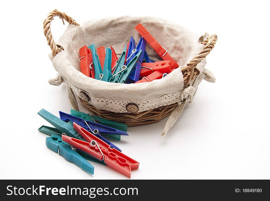 Clothespins in the woven basket with material