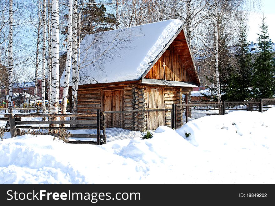 Hut of logs, surrounded by snowdrifts in the winter. Hut of logs, surrounded by snowdrifts in the winter.