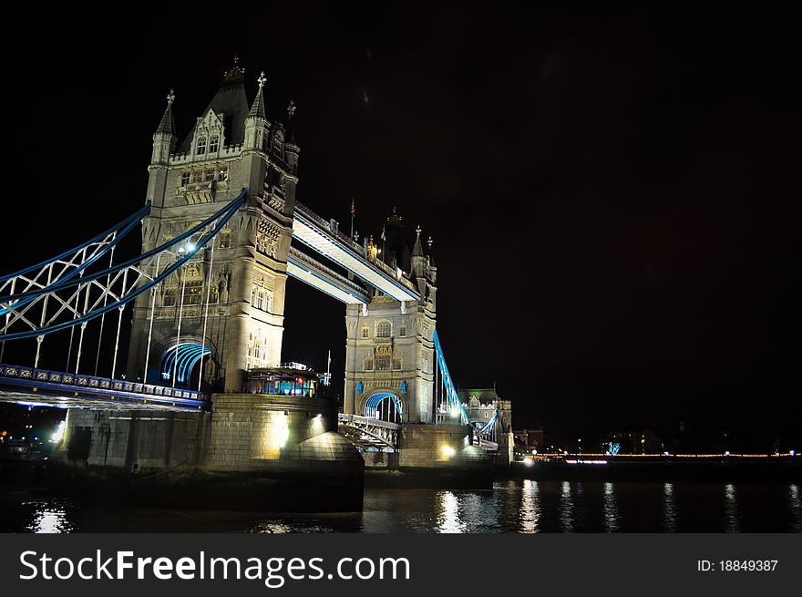 Night photo of Tower Bridge, over the river Thames in London, UK