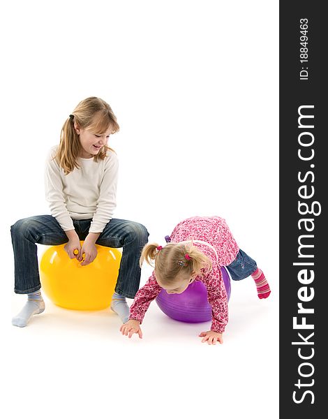 Babies with ball, on white background.