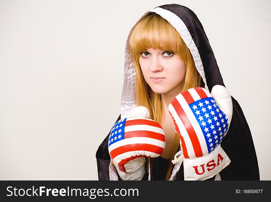 Portrait of a girl boxer on a white background