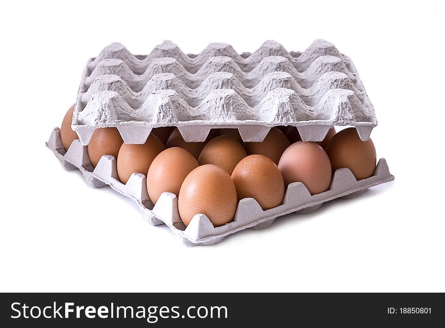 Eggs in carton on white background