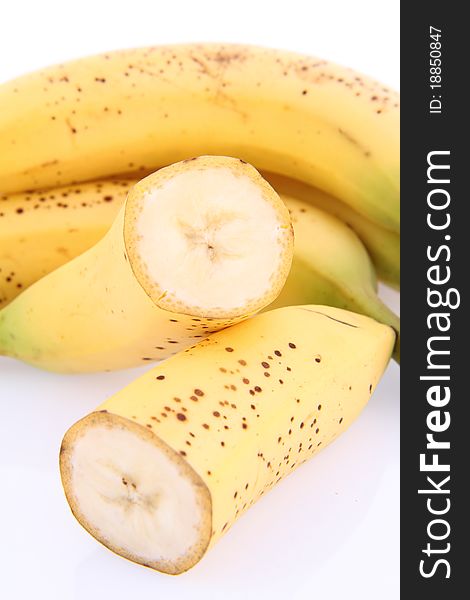 Bananas on white background - one cut in half