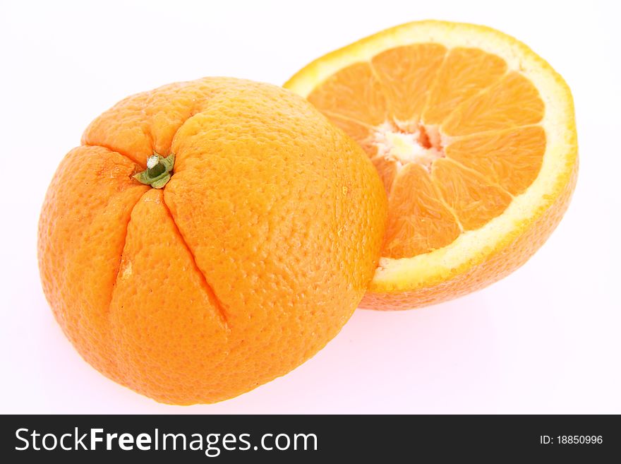 Orange, cut in half, on white background