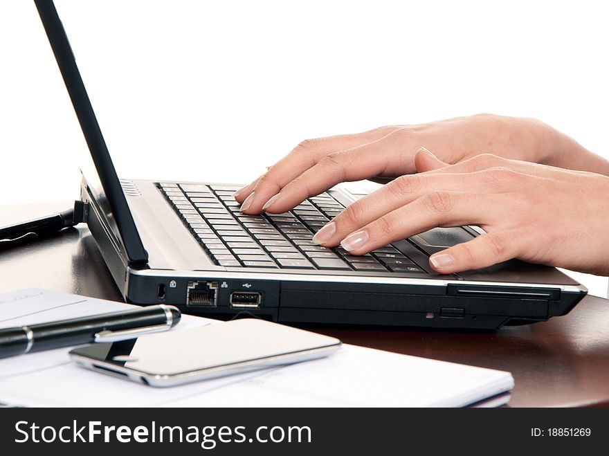 Computer keyboard in an office at a workplace near notebook, pen, cellphone isolated on a white background. Computer keyboard in an office at a workplace near notebook, pen, cellphone isolated on a white background
