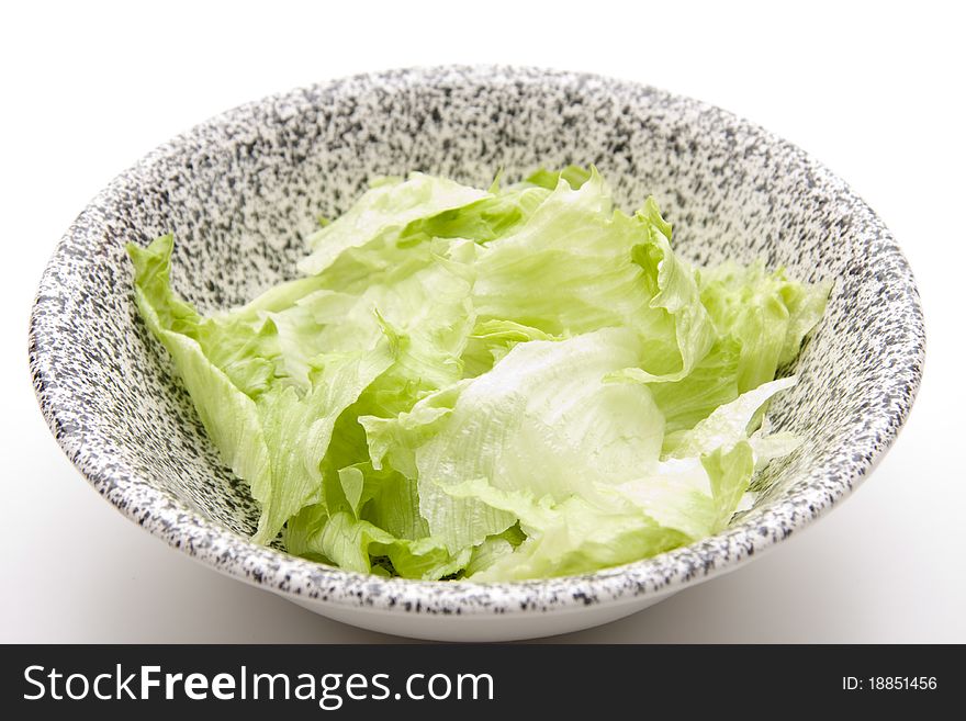 Lettuce leaves in the ceramics bowl