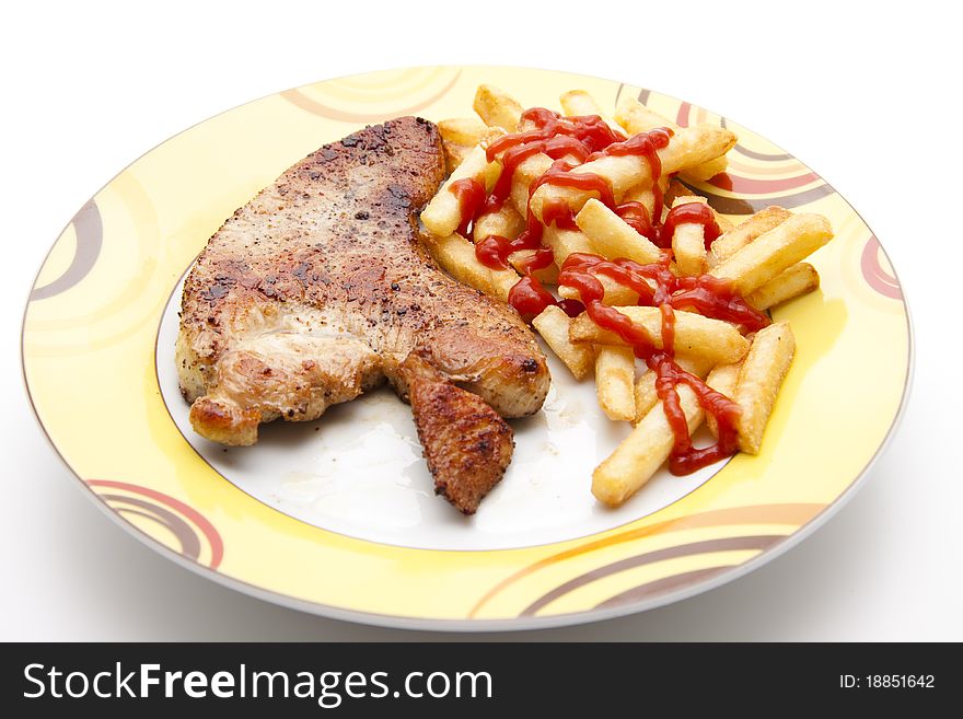 Turkey hen steak with Fries and ketchup