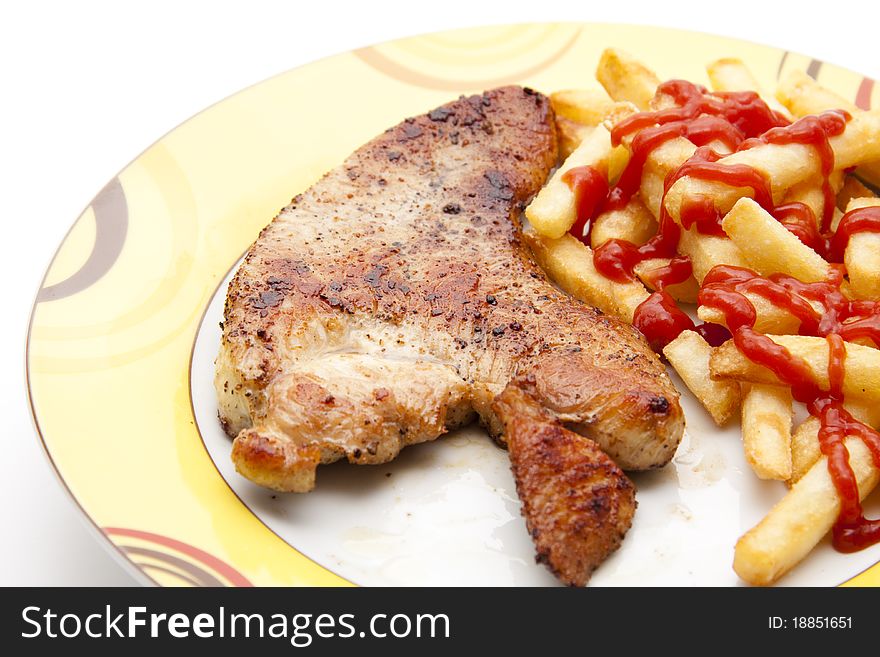 Turkey hen steak roasted with Fries and ketchup