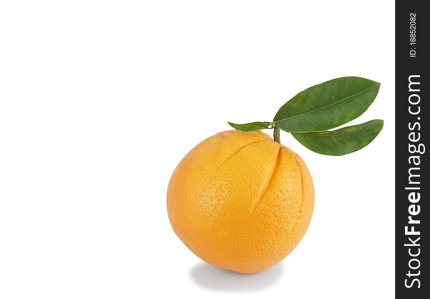 The whole orange with leaves on a white background