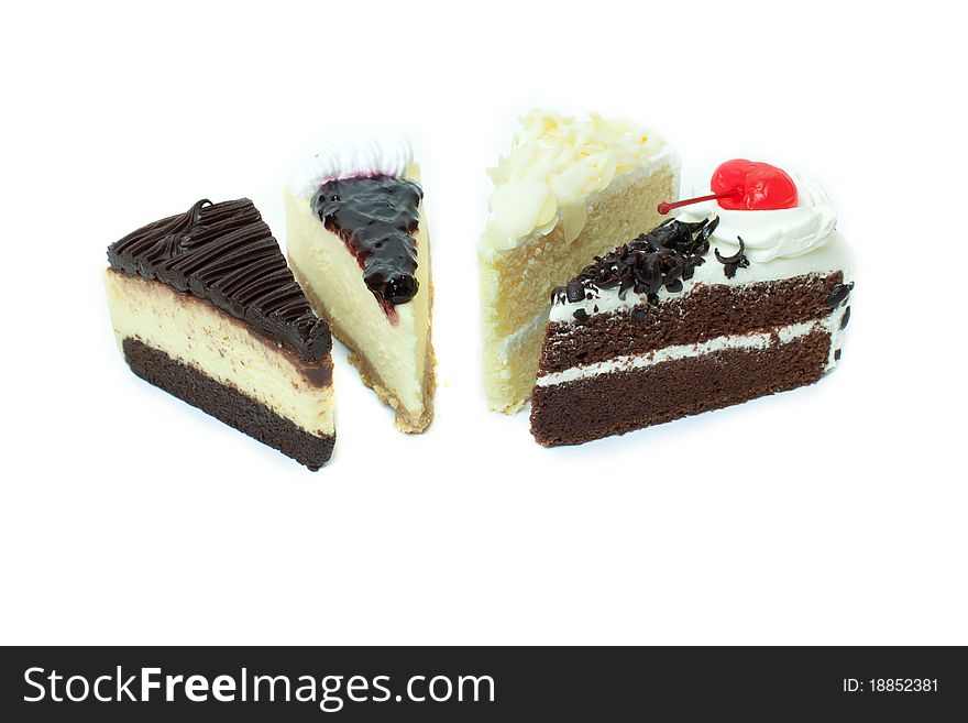 Four different pieces of cake. Isolated on white background.