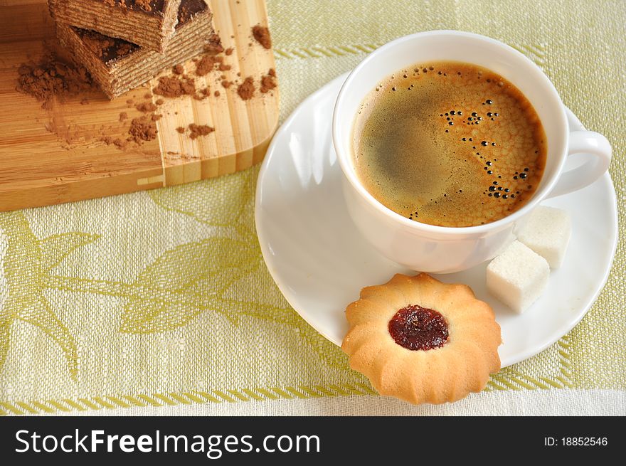 Morning coffee with biscuits and calorie cake. Morning coffee with biscuits and calorie cake