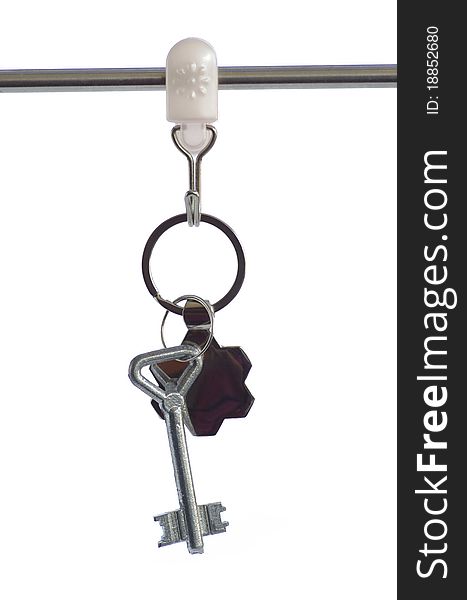 Key from the house, isolated against the white background. Key from the house, isolated against the white background