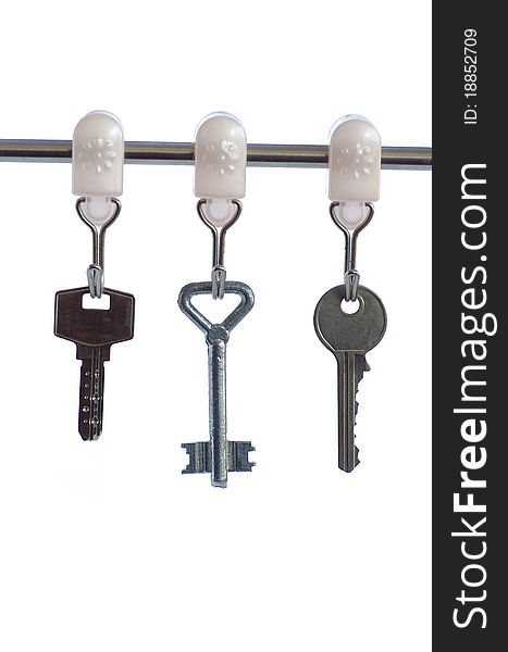 Key from the house, isolated against the white background. Key from the house, isolated against the white background
