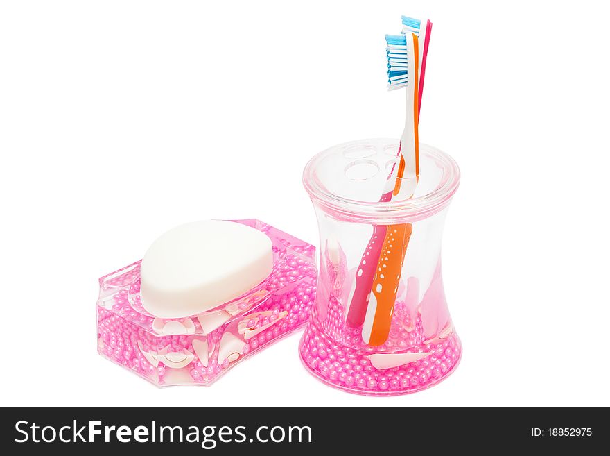 Toothbrushes and soap on a white background