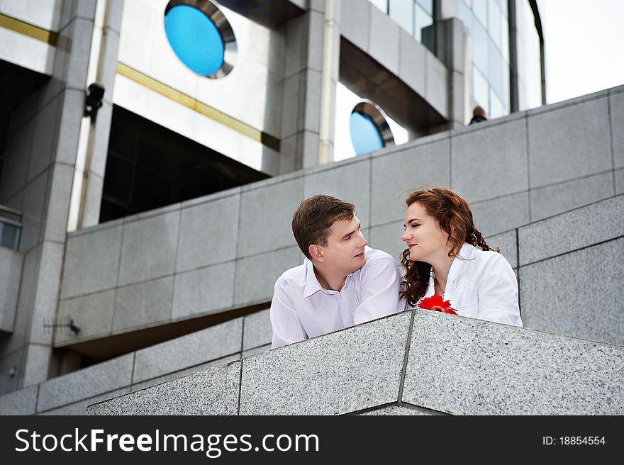 Romantic couple about a modern building in the city