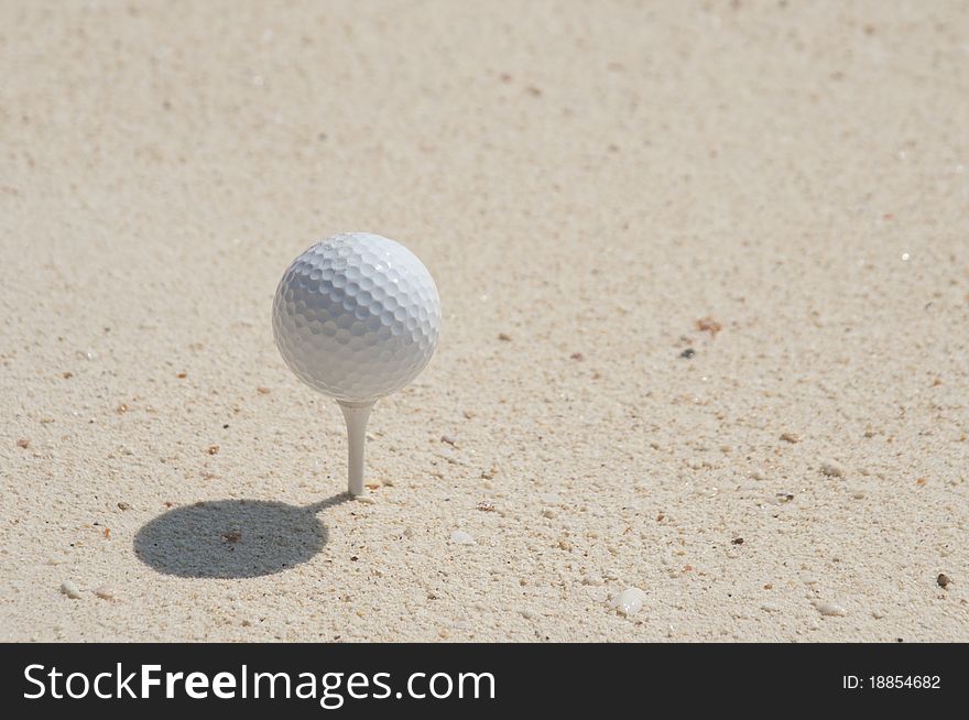 With Golf on the sand.