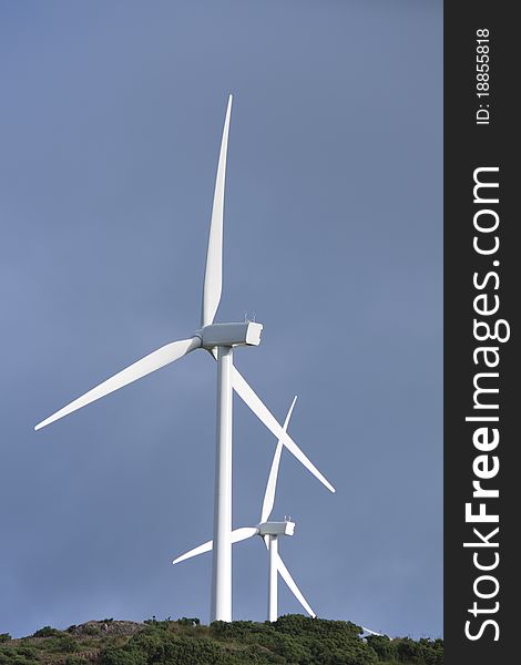 A pair of wind turbines generateing energy