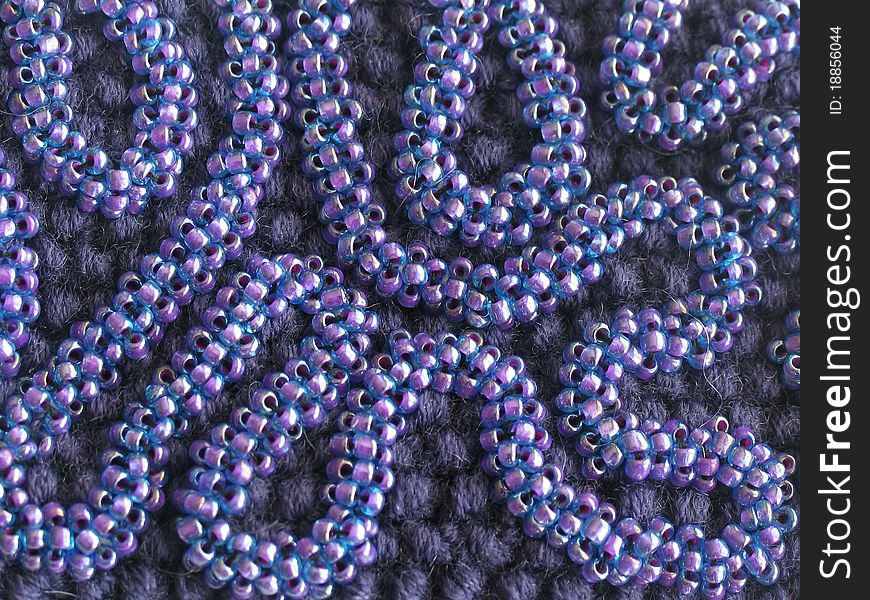 Knit texture with seed beads ornament (violet). Hand-made creative work
