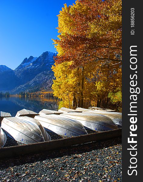 Boats rest on the shore of a beautiful California lake. Boats rest on the shore of a beautiful California lake