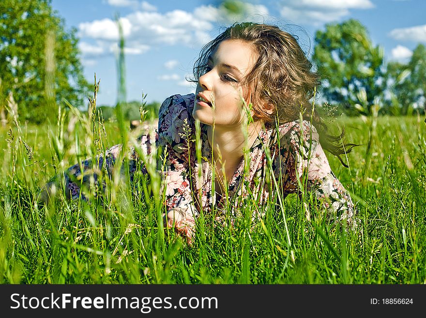 Beautiful girl on the grass