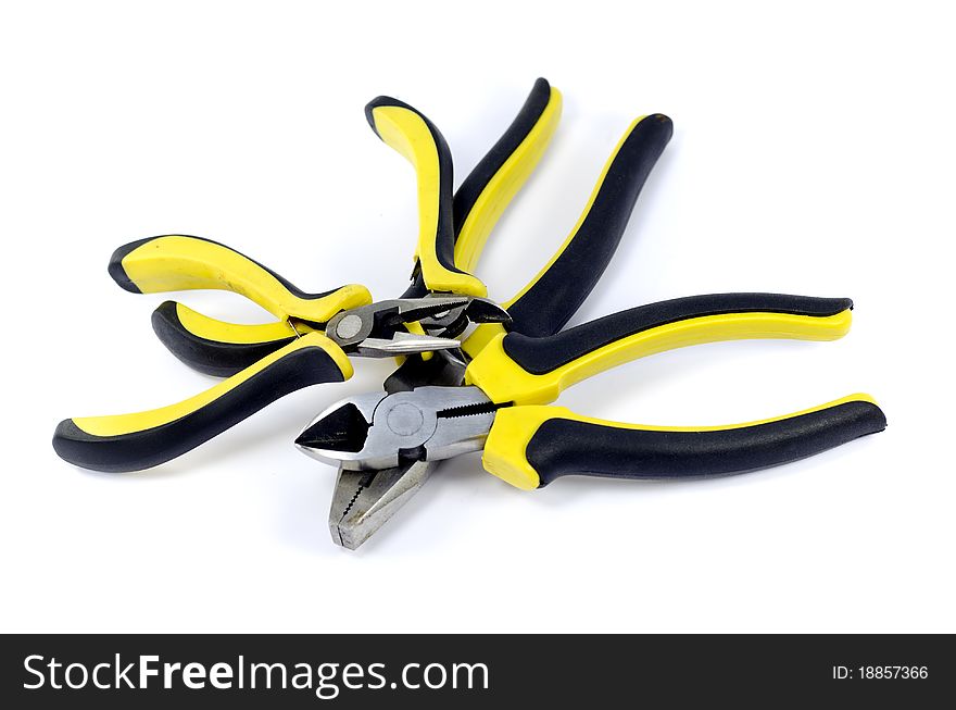 A pile of pliers on white