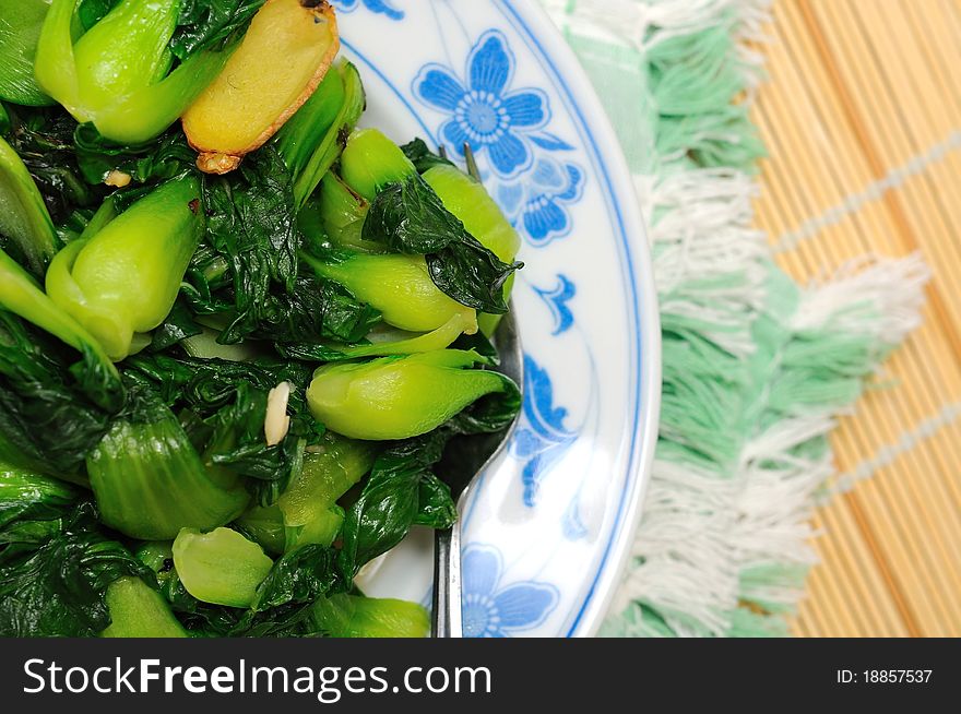 Green vegetables in oriental style kitchenware. Green vegetables in oriental style kitchenware.