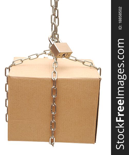 Cardboard box closed with a chain and a lock on a white background