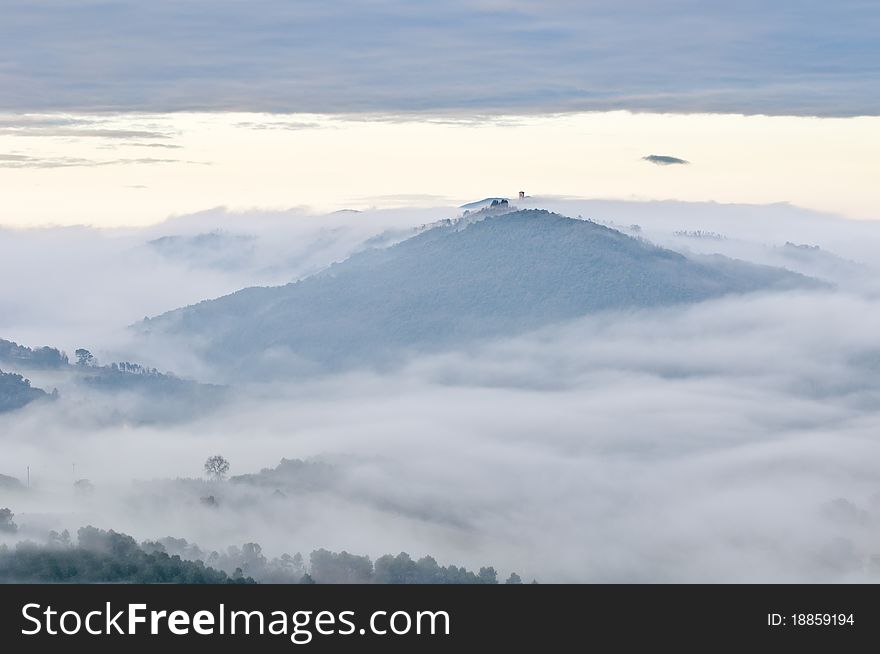 Misty Italian hill top village