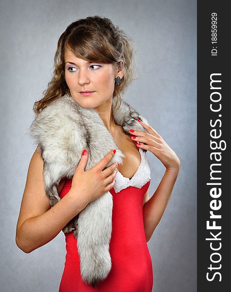 Portrait of young woman in the fur boa. Portrait of young woman in the fur boa.