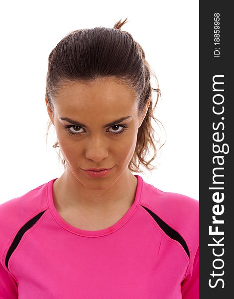 A young girl wearing a pink athletic top on white background. A young girl wearing a pink athletic top on white background