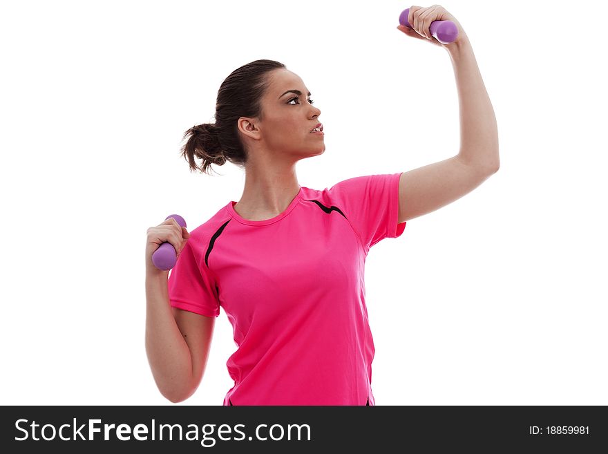 A young female lifting exercise weghts on a white background. A young female lifting exercise weghts on a white background