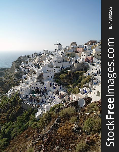 This picture is taken in Oia, Santorini, Greece, and shows how the houses are built, literally on the cliff. This picture is taken in Oia, Santorini, Greece, and shows how the houses are built, literally on the cliff.