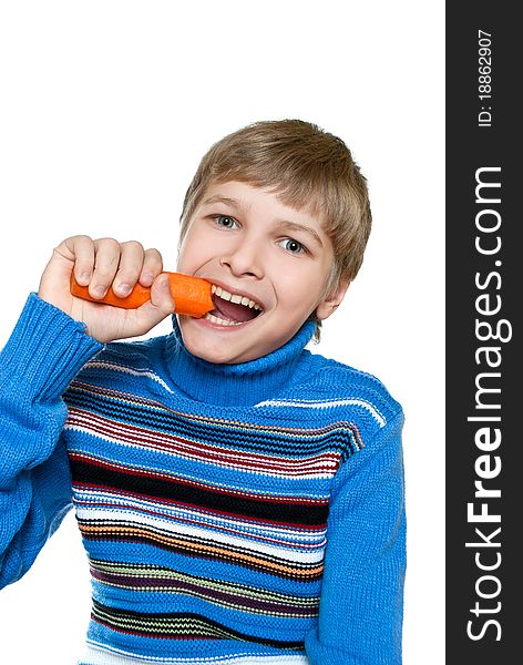 Teen eats carrots. He has strong teeth.