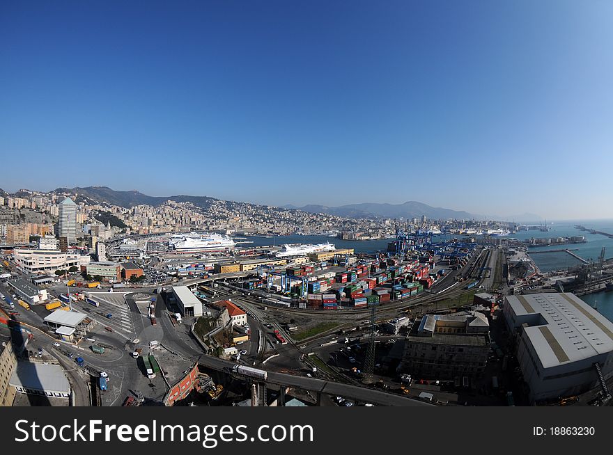 An aerial view of the port the Genoa, during a day of working, and in the background the city between sea and mountains. An aerial view of the port the Genoa, during a day of working, and in the background the city between sea and mountains.