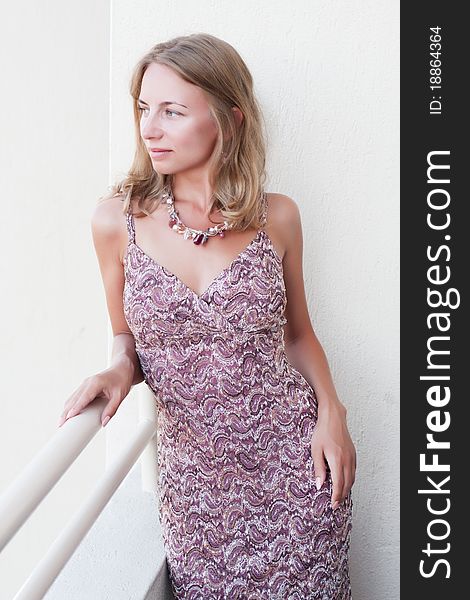 Young luxury beautiful woman on the balcony of the hotel