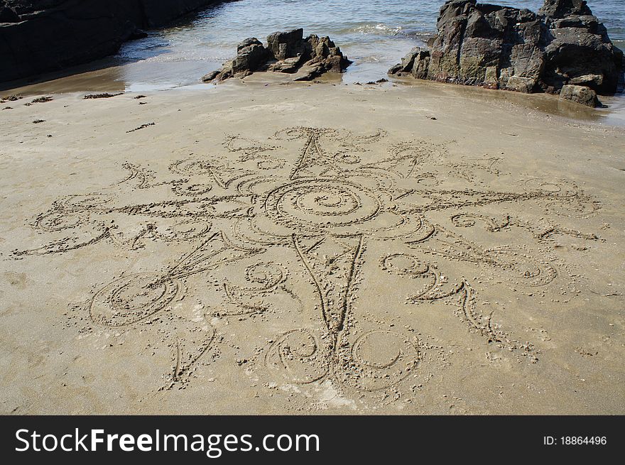 Drawing on the sand on the seashore