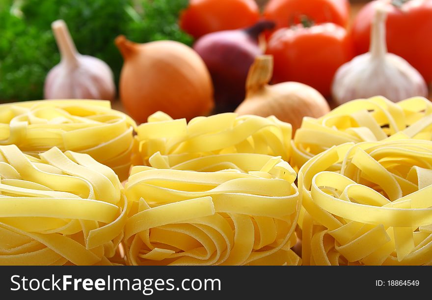 Italian pasta and fresh vegetables on the kitchen table. Italian pasta and fresh vegetables on the kitchen table.