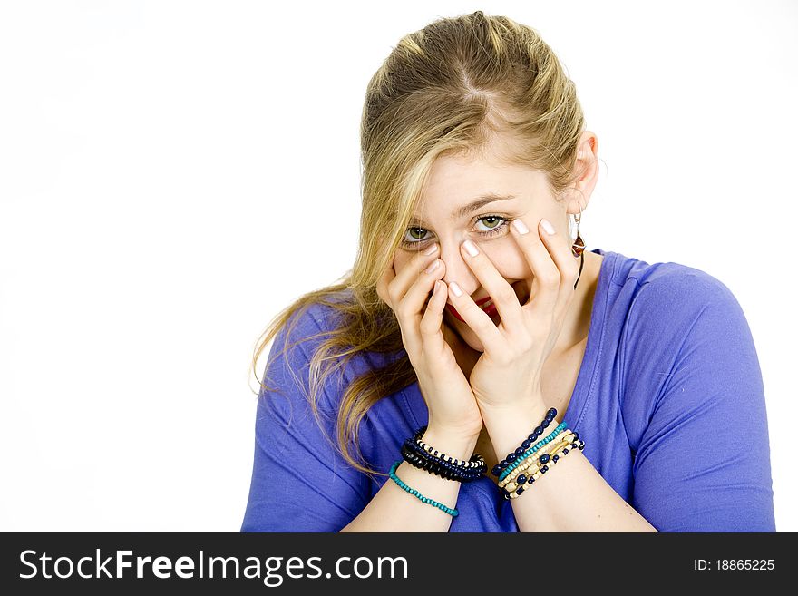 Young blond woman covering her face. Young blond woman covering her face