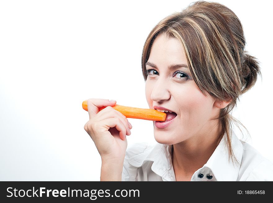 Beautiful girl's face. Healthy eating a carrot. Beautiful girl's face. Healthy eating a carrot.